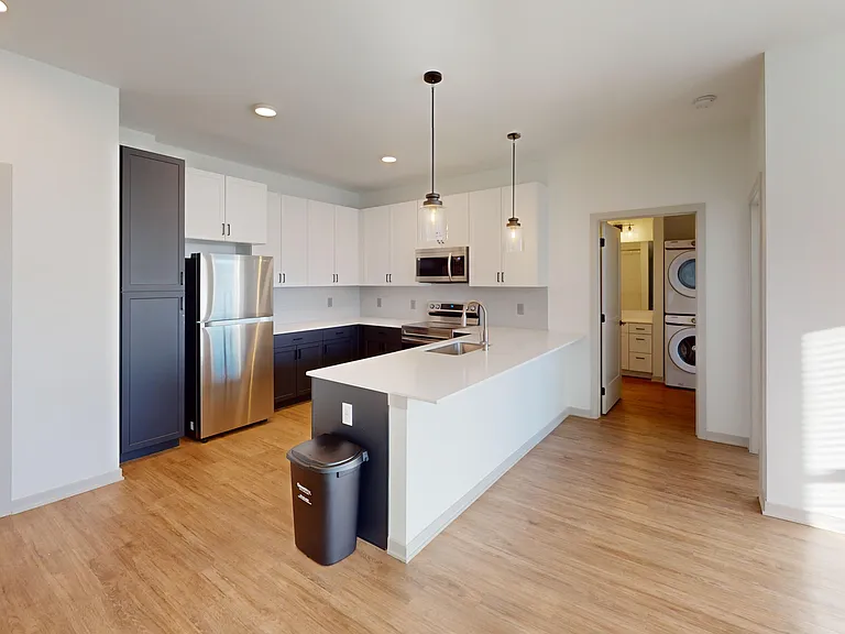 The Katherine features an open-concept layout with a large, modern kitchen. The Katherine features an open-concept layout with a large, modern kitchen.