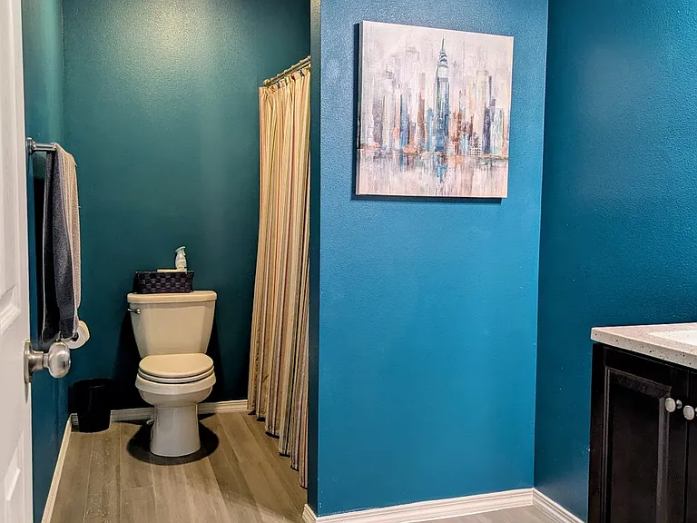 Upstairs hallway bathroom with shower and tub.