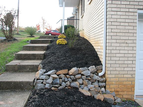 Stone around the landscaping ads a little flavor to its taste buds.