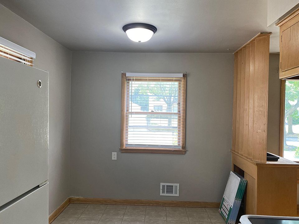 Dining room, view from kitchen. Fridge on left and living room to right.
(Kitchen/dining combo 16'x8')