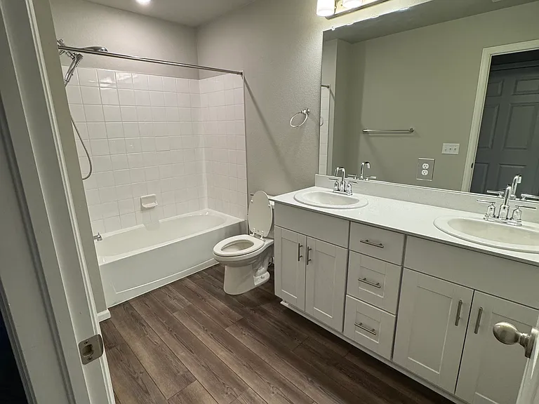 Hallway bathroom with tub