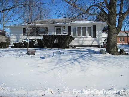 Front view of the house
						:
						detached 2 stall garage on right but snow is covering the blacktop drive