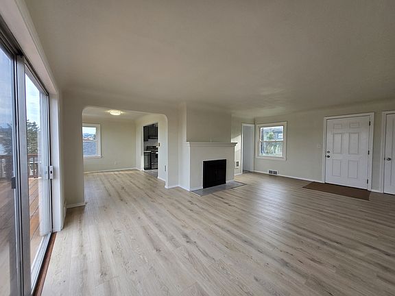 Open living space. New flooring and throughout. Vintage arched doorways.