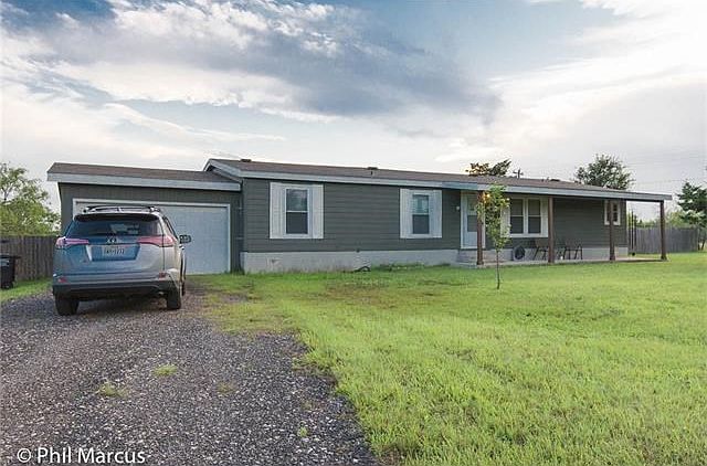 Corner lot with no close homes. Nice long drive way for cars and a covered front porch.