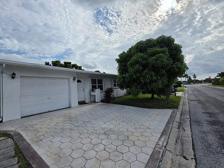 7195 NW 9th Ct — Photo 1