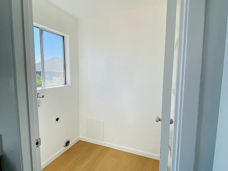 Laundry and pantry area. Comes with included washer and dryer (not shown in photo).