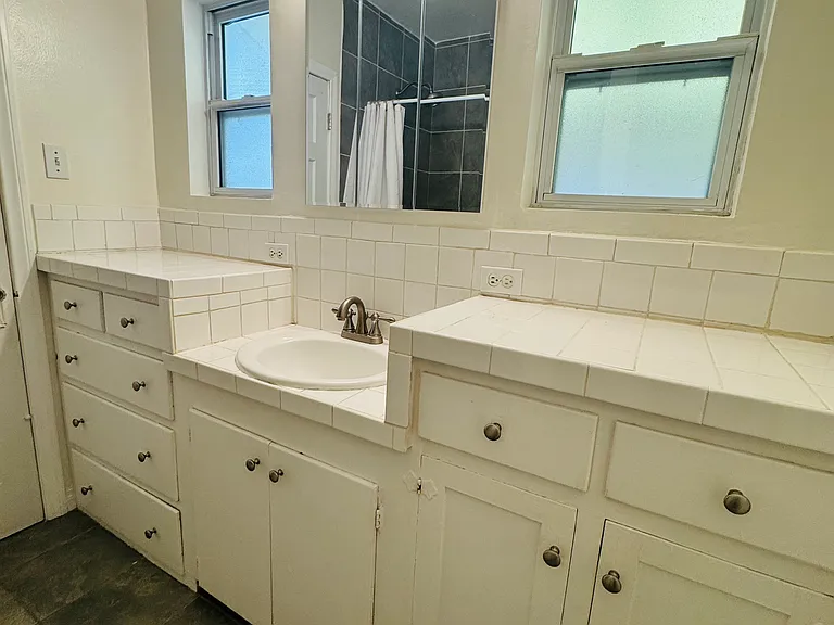 New medicine cabinet and fixtures. Ceiling fan/vent plus windows.