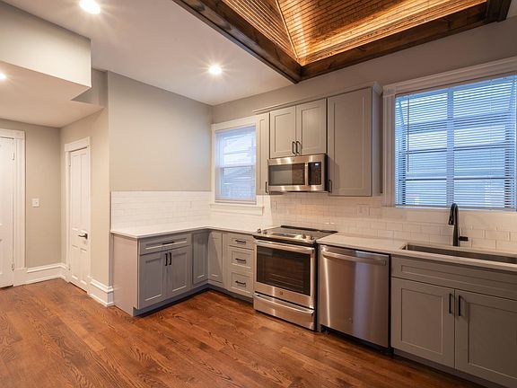 Kitchen. 1/2 bath in door left of counter. Unit entry left-most door.