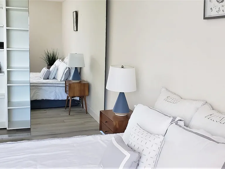302 /802 Bedroom with mirrored closet and built in shelves