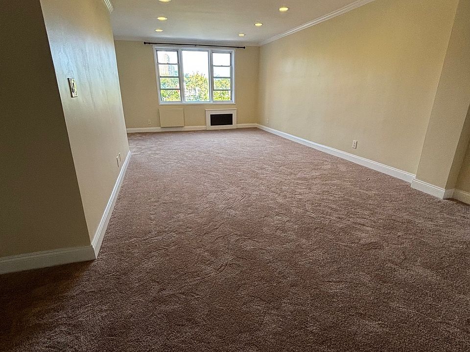Huge L-shaped Living room with lots of natural light and recess lighting