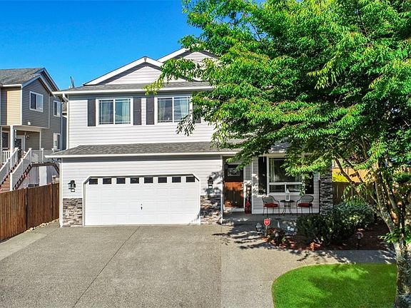 Front of your New home with all of the Upgrades done here. Extra concrete work for more parking and walk-ways around the manicured grounds.