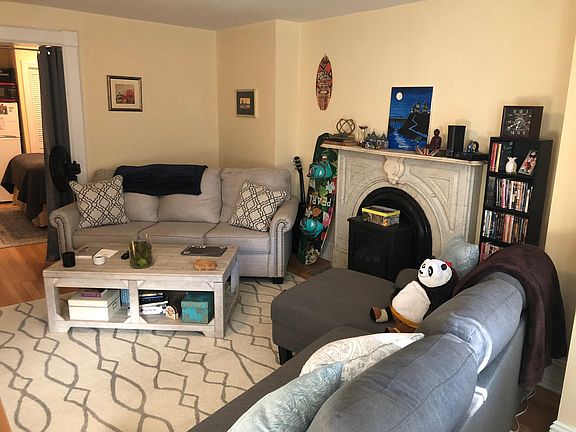 Living room w/ fireplace from windows