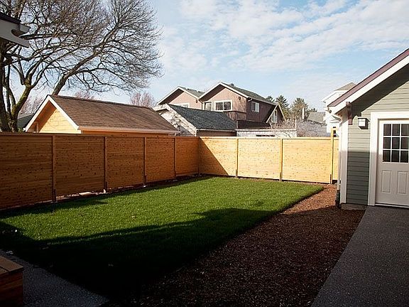 Backyard.  Garage entry to right.
