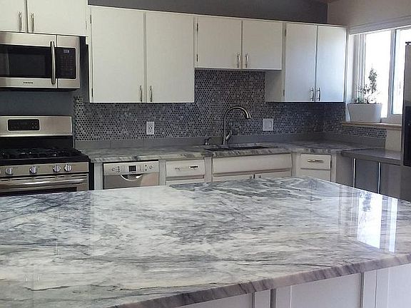 Open White Granite Kitchen