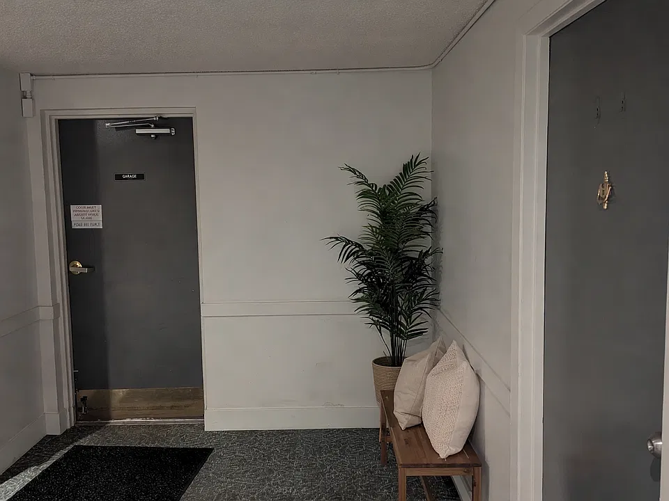 Unit door to the right and garage access straight ahead