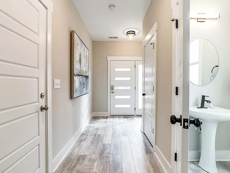Welcoming hallway leads to family room