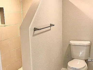 Downstairs bathroom with large shower space.