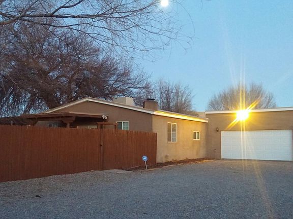 Garage can accomodate two cars + work area.