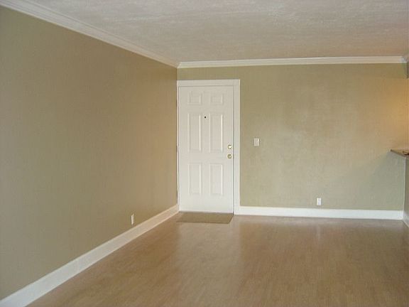 Wood floors in living room create a roomy elegant look.