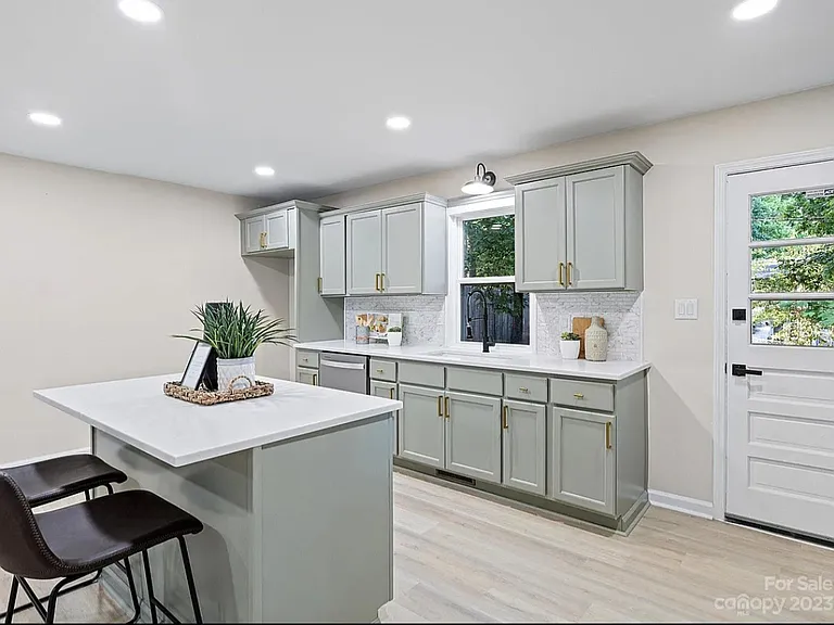 Spacious open-concept kitchen. New SS French door refrigerator included (not pictured).