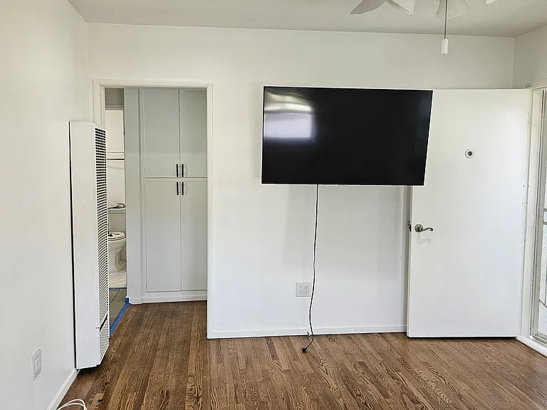 Front door is on the right corner; entrance to hall is on the top left corner, showing doors to hall closet.