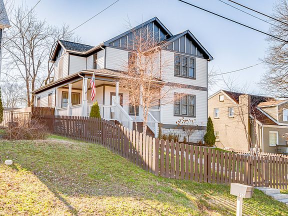 Fenced in front and backyard with covered porch and porch swing!