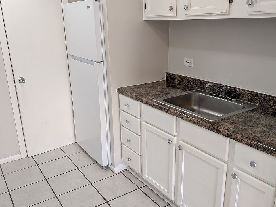 KITCHEN WITH NEW CABINETS AND REFRIGERATOR