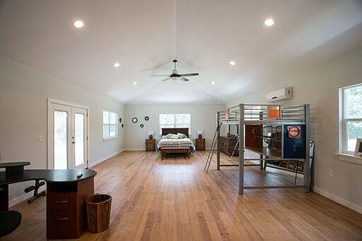 Entire space with out bedroom partitions.