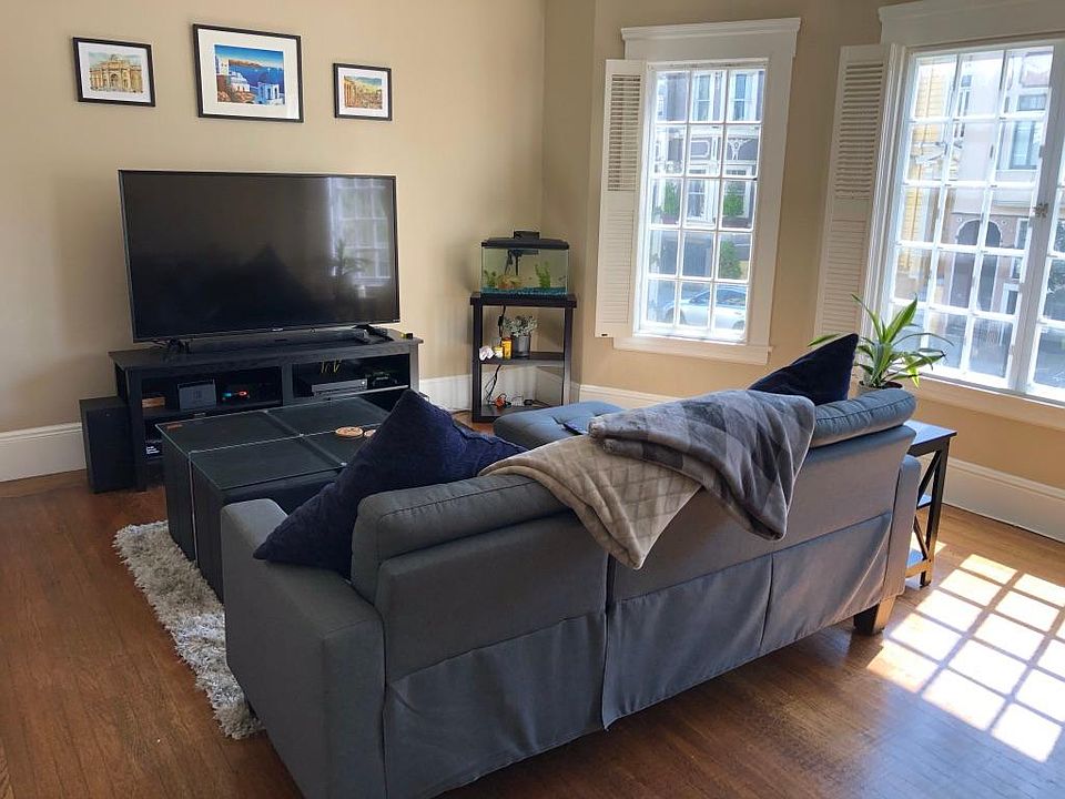 Bright living room with brand new windows and shutters
