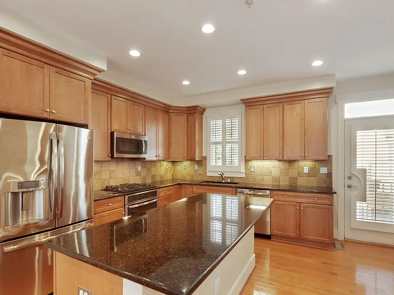Kitchen with Island, Granite Counters and Stainless Appliances