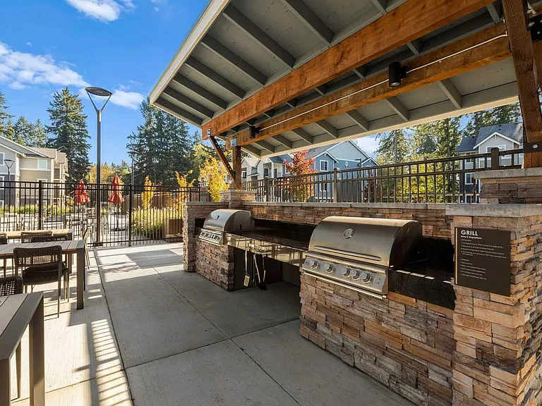 The ultimate recipe for outdoor living. Grill by the pool at the Modera Lacey grilling station.