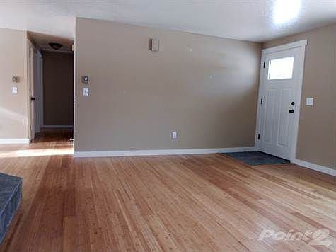 living toward door and hall