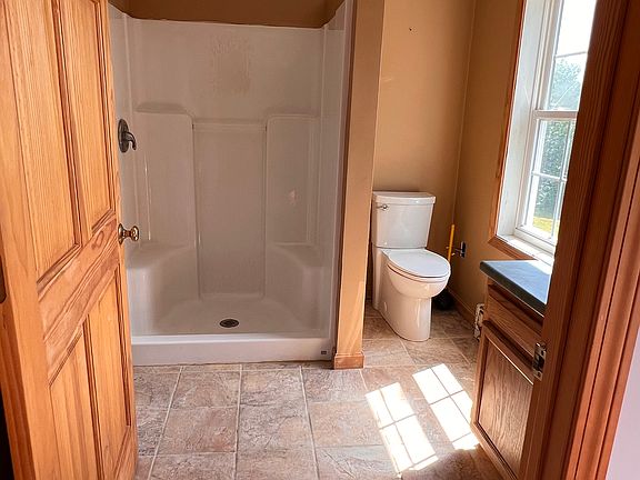Stackable washer/dryer behind door
