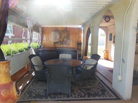 Covered patio with hot tub