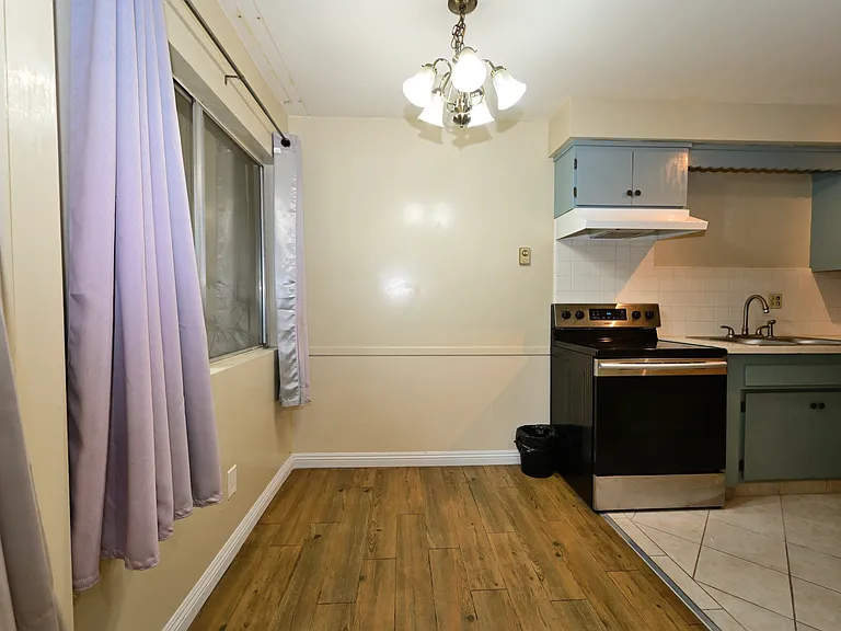 Updated kitchen with quartz countertop, SS appliances.