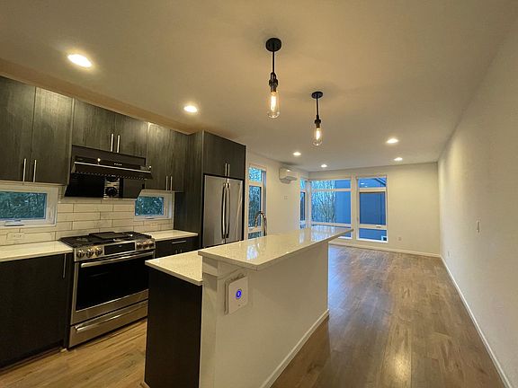 Living room and kitchen with hardwood floors