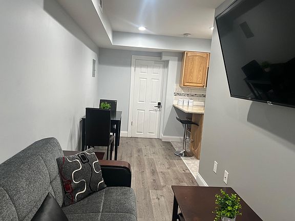 LIVING/DINING AREA TO ENTRY DOOR