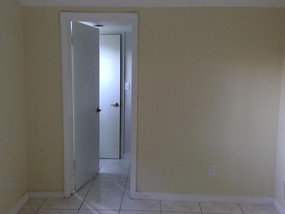 Bedroom showing entrance to bathroom