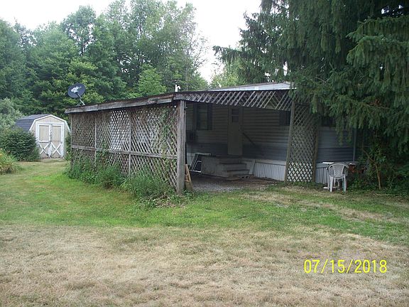 Car port. The storage barn is on the left.