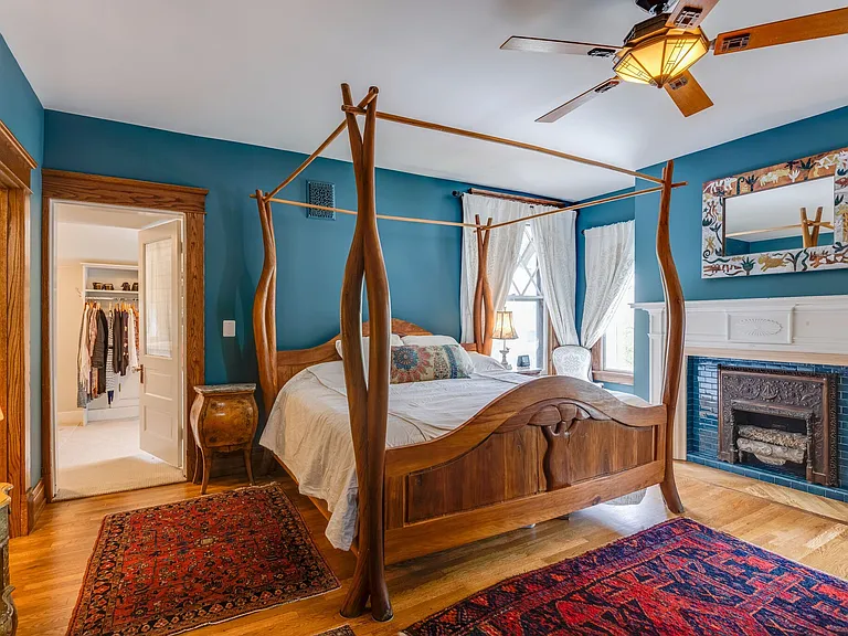 Primary Bedroom with fireplace, walk-in closet and en suite