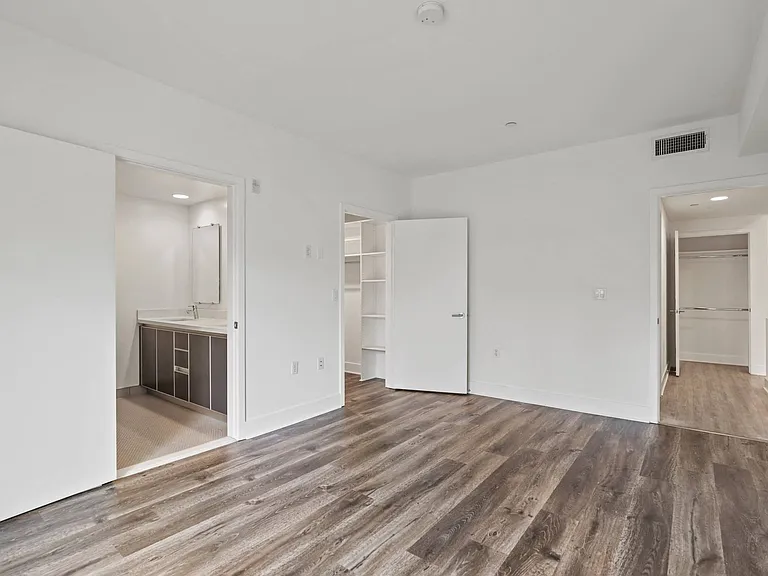 Bedroom with Bathroom and Walk-In Closet with Shelves