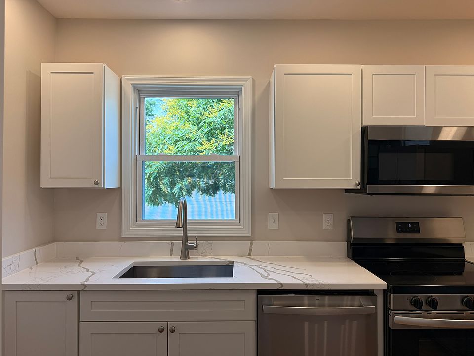 KITCHEN - all brand new appliances, fixtures, finishes, windows. Sizable kitchen lots of cabinet/storage space, brand new cabinets, quartz countertops, and wonderful lighting.