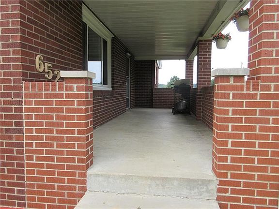 Relax outside on the covered 22x7ft. covered front porch.