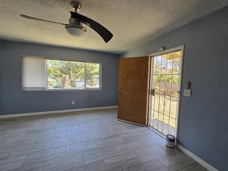Livingroom with large windows and door. Awesome air flow.