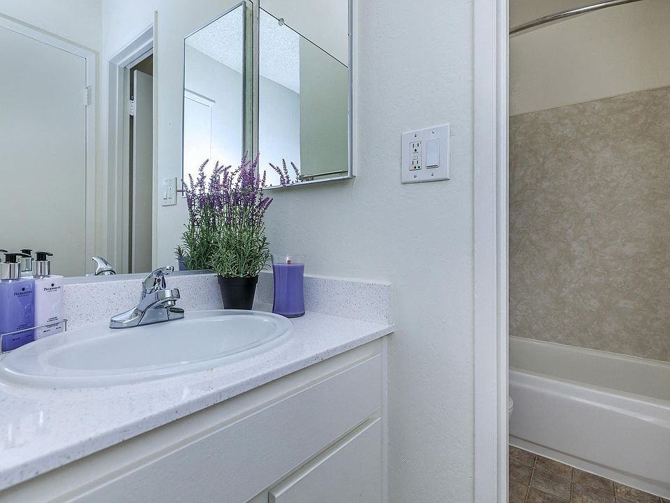Spacious vanity and the bathtub at the Riverview Apartments in a one bedroom floorplan