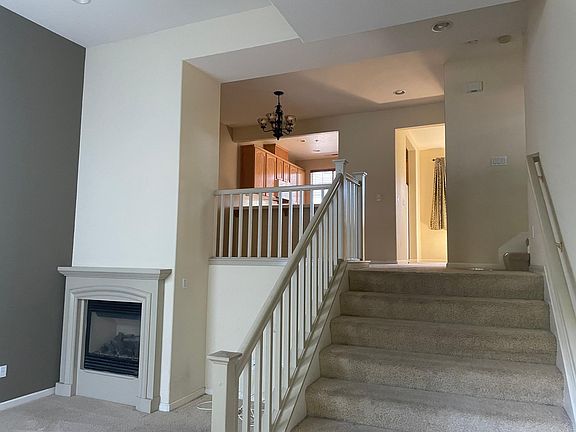 Living room on the left and upstairs to dining, kitchen and nook