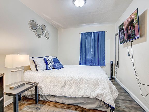 Bedroom with comfy queen-sized bed and new comforter and sheets