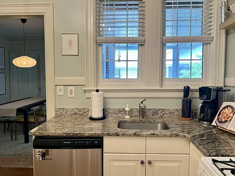 Kitchen window overlooks the screened-in porch