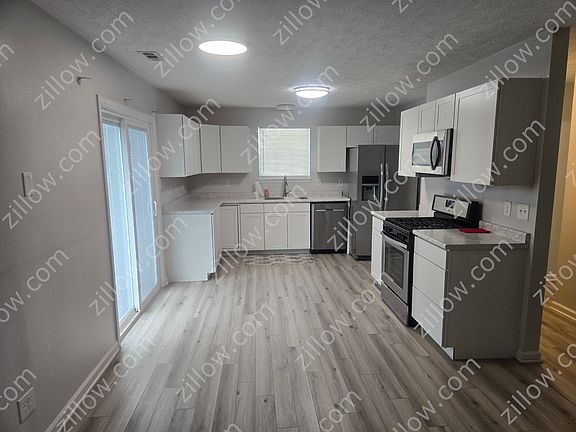 Two year old kitchen. The stove, dishwasher and microwave stay. The refrigerator is not included but is available. Brand new window and sliding door with internal blinds.