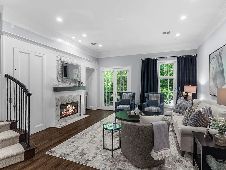 Elegant 2nd-floor living space featuring a cozy fireplace and seamless flow.